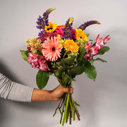 Cheerful bouquet with seasonal flowers in bright colours, that will dazzle anyone's day. Delivering flowers everyday in the lower mainland.