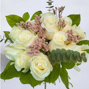 A dozen gorgeous white roses with seasonal greenery and filler flower, are the perfect romantic gift to send to the one who's always on your mind and in your heart.