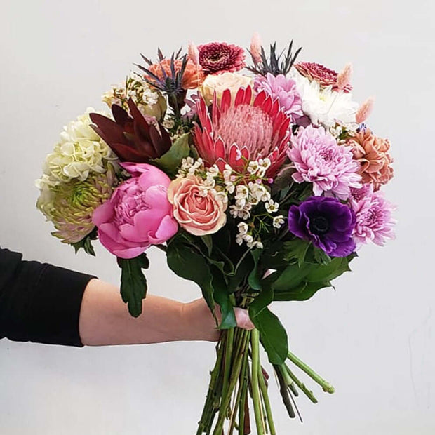 Gorgeous bouquet in soft pink, purple, hues and whites. Adding tropical flowers like the protea and leucadendron to make the bouquet as special as your favourite person.