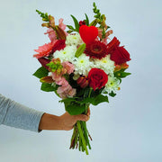 Let the florist design something special to send your love with the season's flowers in white, pink and red.