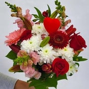 Let the florist design something special to send your love with the season's flowers in white, pink and red.