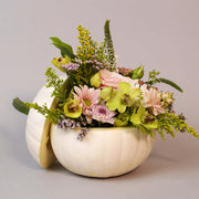 White natural pumpking beautifully filled with fresh flowers