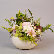 White natural pumpking beautifully filled with fresh flowers